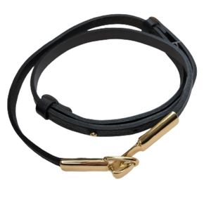 Black adjustable strap belt. Gold hook 1/2 inch wide